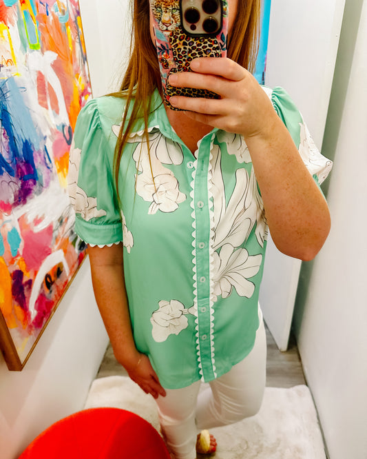 Green top with white floral and rick rack